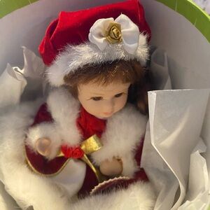 A beautiful Christmas doll🎄￼ dress in red velvet ,white fur  beautiful porclein🎄